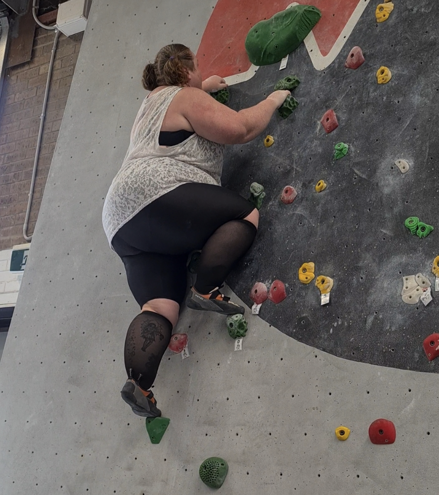 A plus size woman climbing 